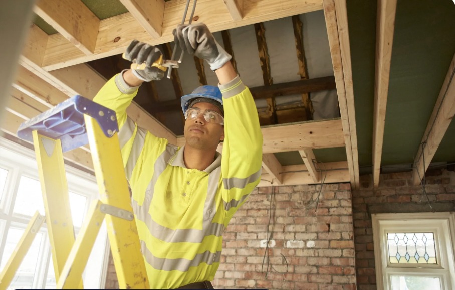 Electrician carrying out rewiring work